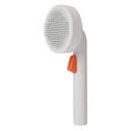 Четка PETKIT Grooming Brush 2 в бяло с оранжев бутон, изглед под ъгъл